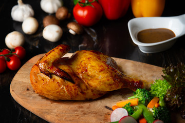 Fototapeta na wymiar roasted chicken on a wooden board