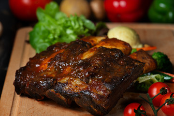 lamb ribs on dark background