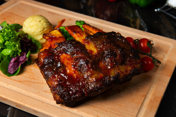 lamb ribs on dark background