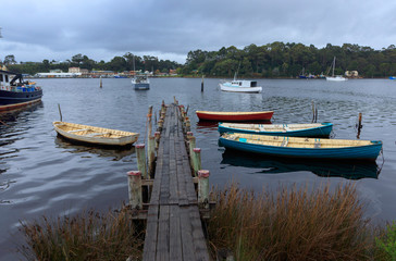 Boats tied to jetty at Strahan Tasmania
