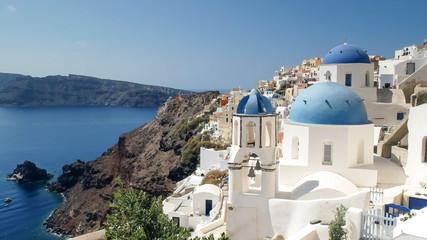 wide shot of the famous three domes in oia, santorini
