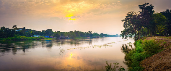 Fototapeta na wymiar Sunrise over the river Kwai, Kanchanaburi, Thailand. Panorama