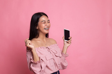 Happy Young Asian woman with mobile phone.