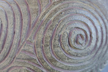 Fototapeta na wymiar テクスチャ―　陶磁器に刻まれた渦巻の模様