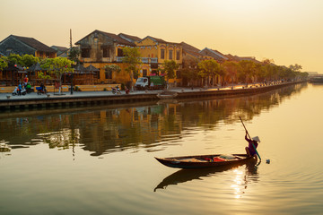 Awesome view of Vietnamese woman on boat at sunrise, Hoian