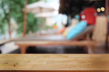Empty dark wooden table in front of abstract blurred bokeh background of restaurant . can be used for display or montage your products.Mock up for space.