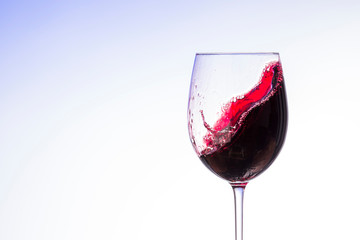 wine splashes in glasses isolated on white background