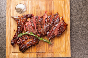 food, delicious, horse meat and craft concept - serving of grilled steak