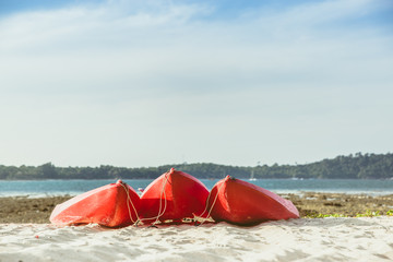 Red kayaks on the tropical beach. South of Thailand beach.