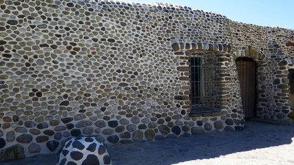 Building covered in smooth stones