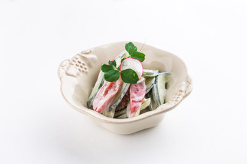 Fresh Vegetables Salad with Sour Cream in a bowl isolated on white background