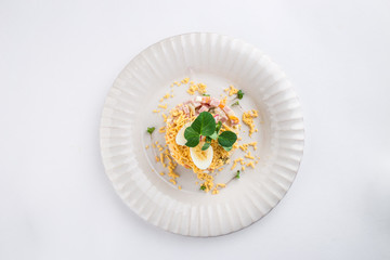 Russian traditional salad Olivier with egg isolated on white background