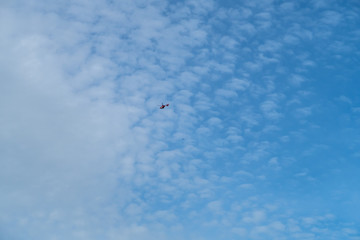 Naklejka na ściany i meble helicopter and airplane in the sky