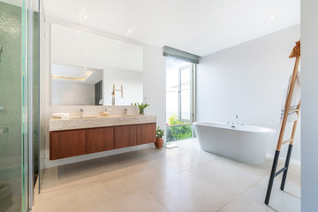 Luxury bathroom features basin and bathtub home, house ,building