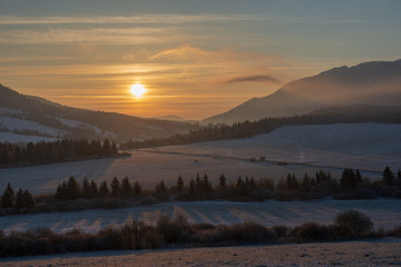 beautiful sunrise in winter in the mountains