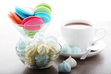 A cup of coffee and macaroons ready for breakfast