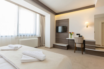 Naklejka na ściany i meble Interior of a modern double bed hotel bedroom