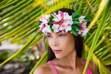 Tahiti beauty woman wearing flower head wreath traditional Tahitian cultural accessory. Bora Bora,...