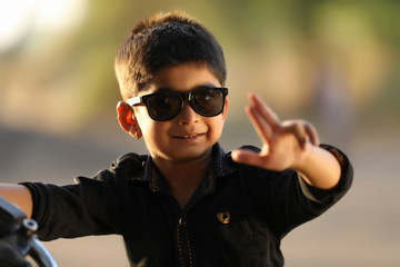 Cute Indian child wear sunglasses