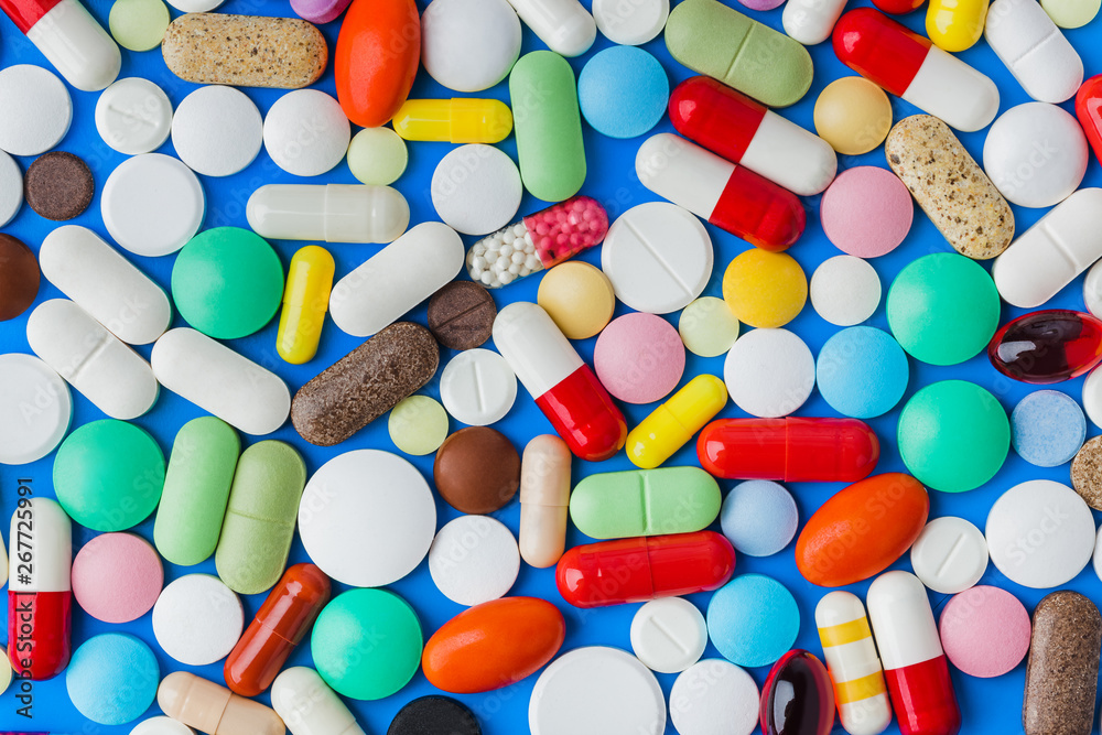 Poster heap of pills - medical background