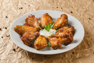 roasted chicken in plate with sauce