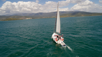 Aerial view of sailboat at sea in Turkey. Aerial view of beautiful green lagoon at hot summer day