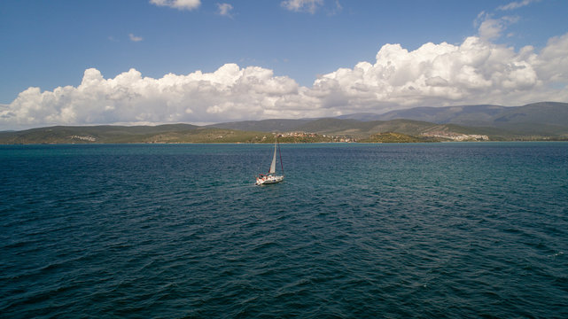 Aerial view of sailboat at sea in Turkey. Aerial view of beautiful green lagoon at hot summer day