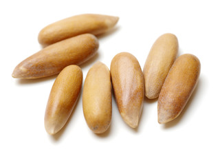 Pine nuts on white background