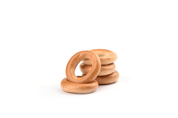 Several crispy bagels isolated on white background.