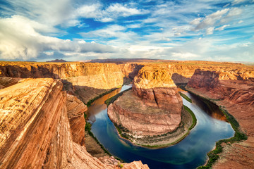 Horseshoe Bend on Colorado River at Beautiful Sunrise with Bright Blue Sky, Utah - Powered by Adobe