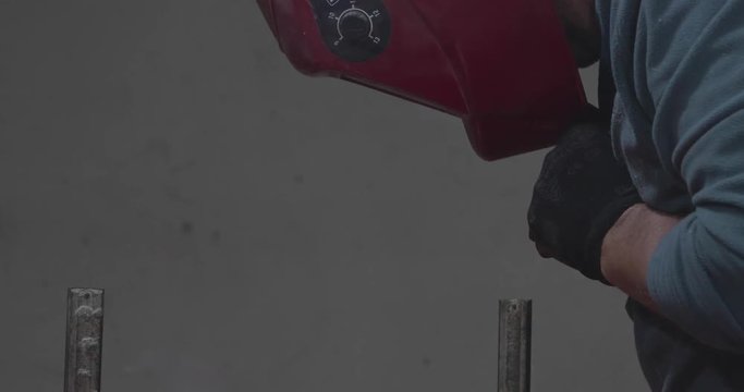 A Man with a Mask Welding