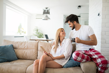 Young attractive couple spending time together at home