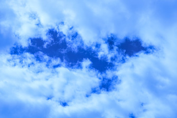 Cloudy blue sky in summer day. Fluffy clouds in the sky.