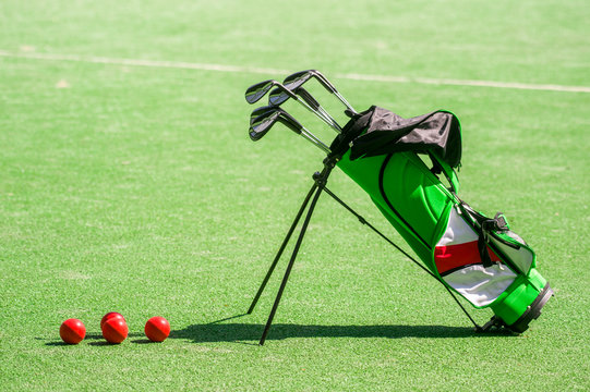 golf equipment and golf bag on green grass