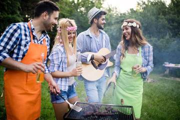 Friends having a barbecue party in nature