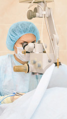 Pretty doctor woman portrait. Ophthalmology laser microscope operation. Clinic room. Patient eye treatment. Myopia and cataract removal
