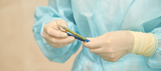 Ophthalmology laser microscope operation. Clinic room with doctor and parient. Gloves and medicine tools