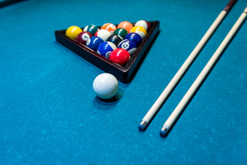 Billiard balls in triangle with cue on table