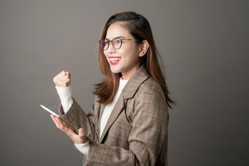 Portrait of Attractive business woman in studio grey background