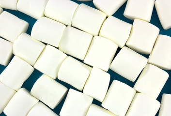 White marshmallows as background. Fluffy marshmallows texture.
