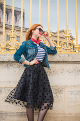 Paris vacation, vintage fashion style . Woman at France. Stylish beautiful modern lady in city