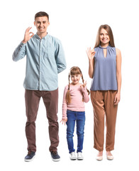 Fototapeta premium Deaf mute family using sign language on white background