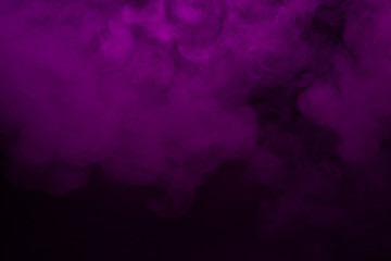Colorful smoke close-up on a black background