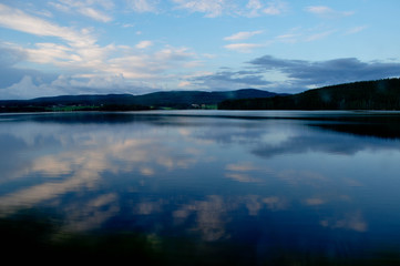 The sky is reflecting in a lake