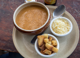 Fish soup with croutons and cheese in Cancale. Brittany, France