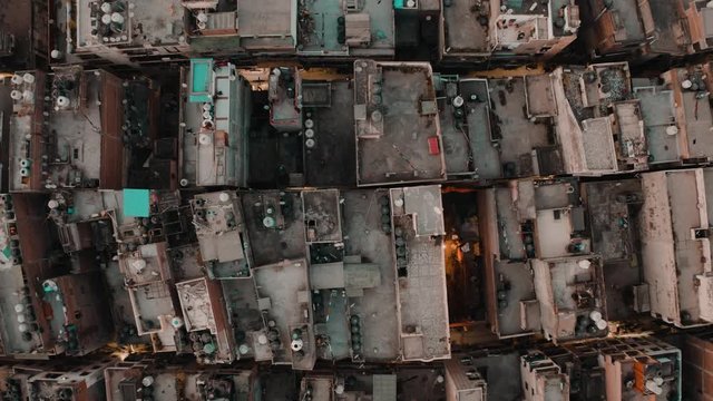 India, Delhi city center slums roofs aerial 4k drone footage, evening dusk