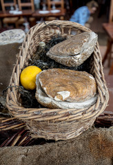 Fresh raw oysters on outdoor street market in Cancale town in Brittany, France