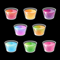 Set of multicolored jelly shots in small plastic cups.