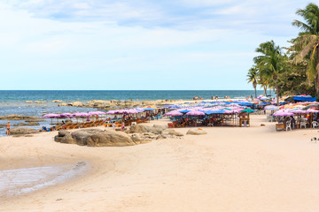 Beach umbrellas and tourists on the beach