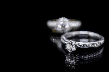 Close up Jewelry diamond ring on black background with reflection